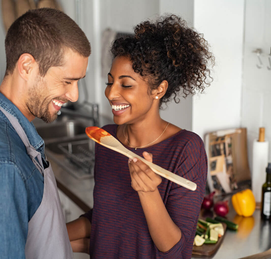 Couple cooking in kitchen