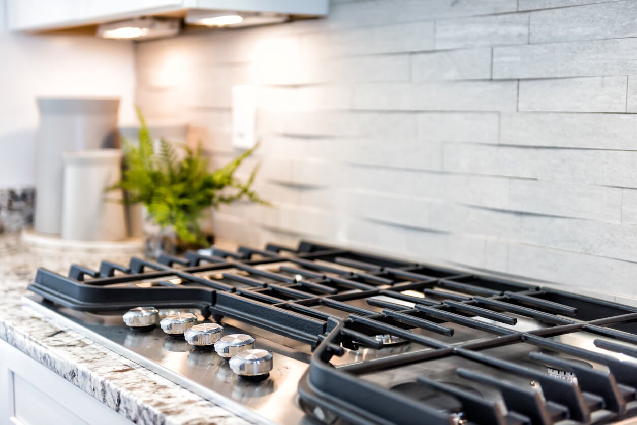 The Secret To Cleaning Your Stove May Be Just A Lift Away