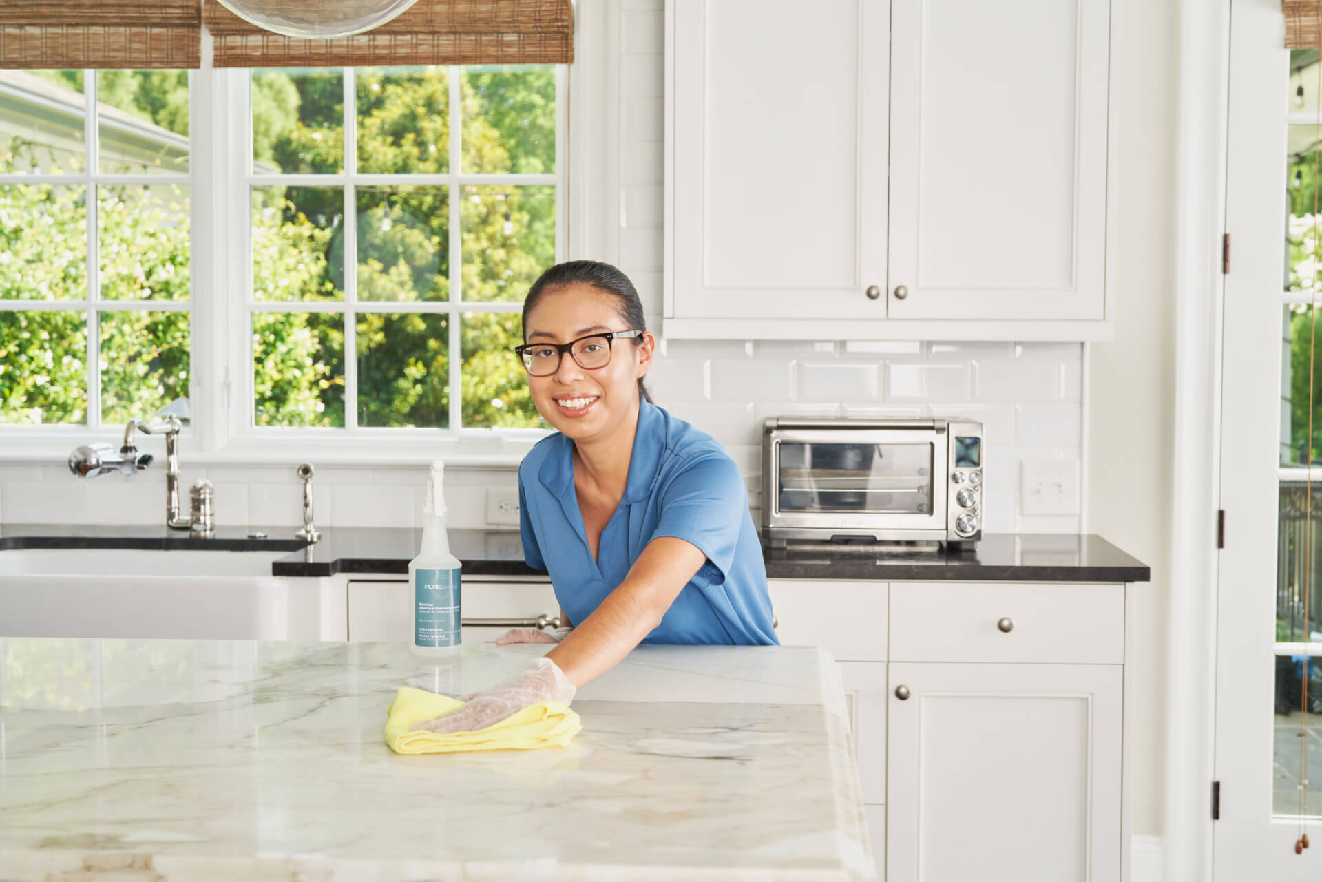 maid cleaning surface