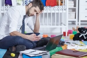 Man sitting infront of laptop stressed out