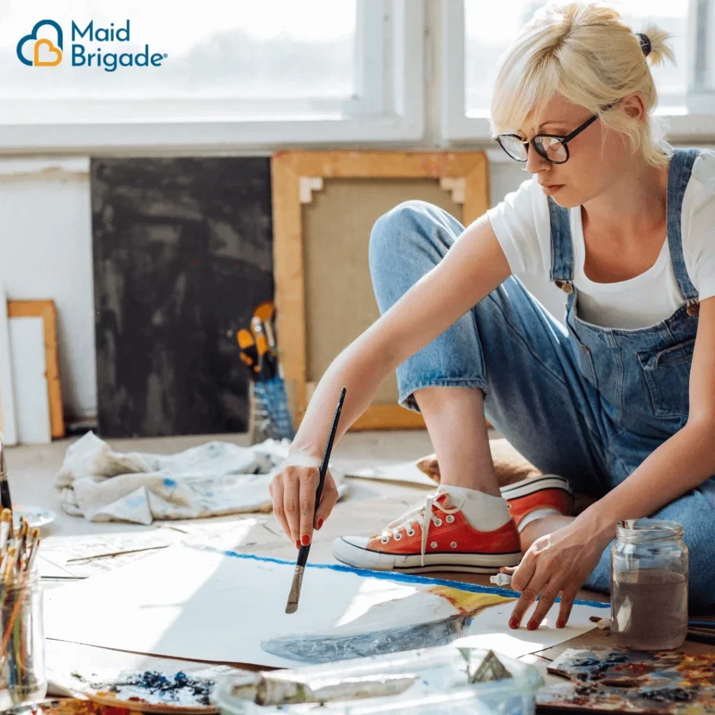 a woman painting in her spare time
