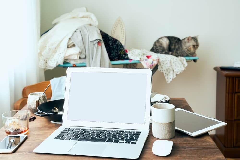 laptop on a messy desk